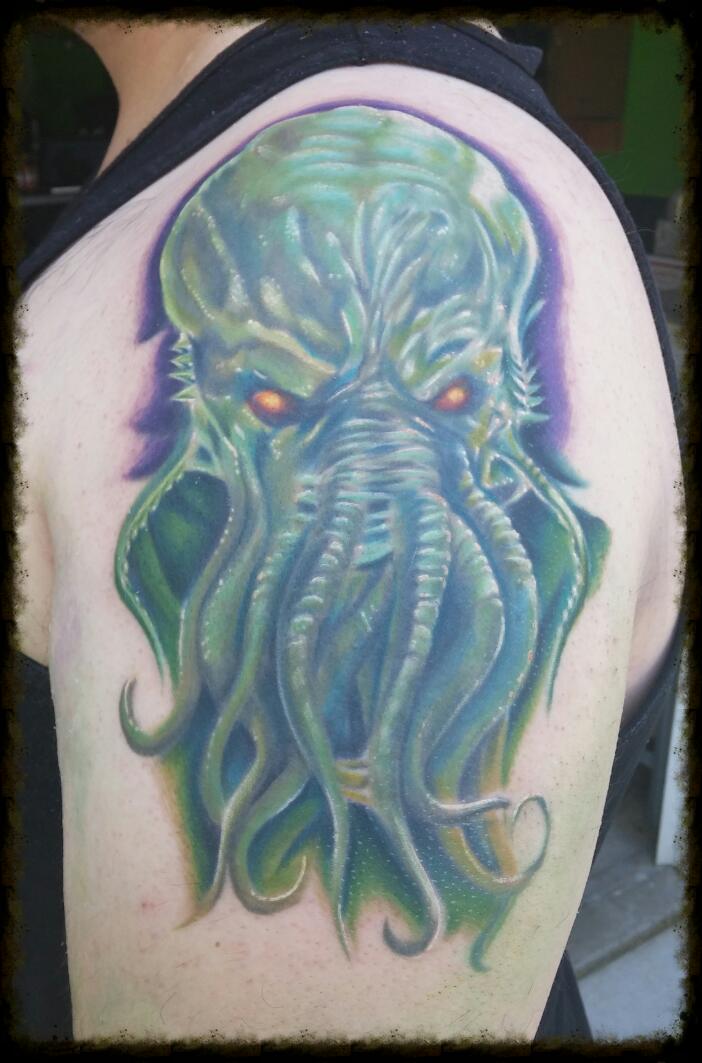 Red Eyes Green Cthulhu Tattoo On Left Shoulder