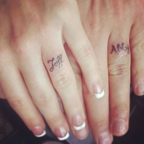 Simple And Smal Name Matching Tattoos On Fingers