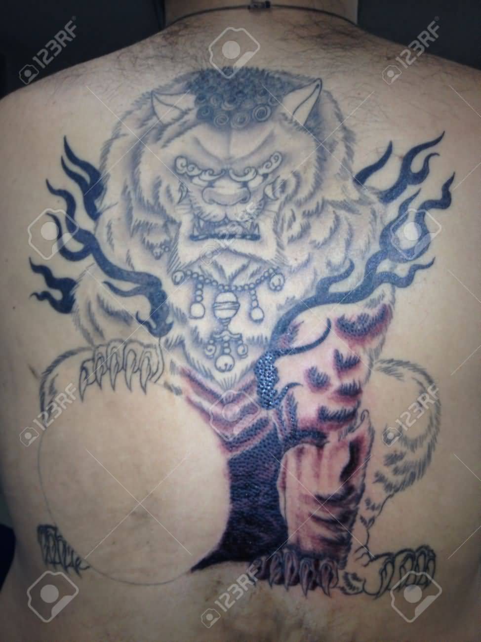 Simple Foo Dog Tattoo On Back