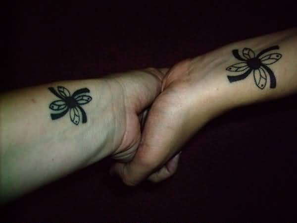 Simple Friendship Flower Matching Tattoo On Wrists