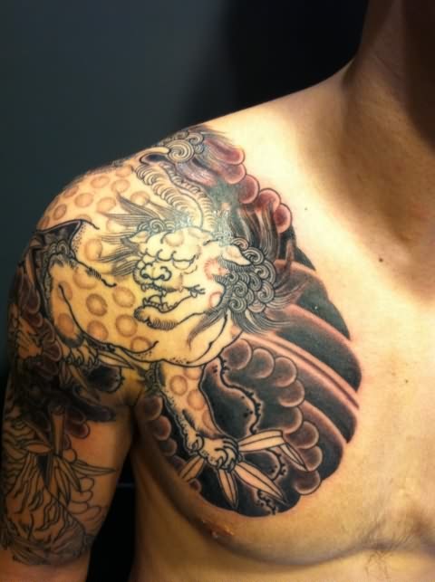 Simple Japanese Foo Dog With Clouds Tattoo On Shoulder To Chest