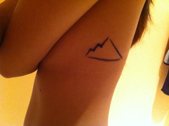 Simple Mountain Outline Tattoo On Side Rib