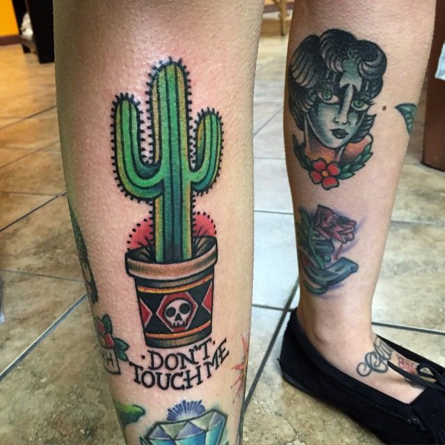 Skull On Pot And Saguaro Cactus Traditional Tattoo On Leg.