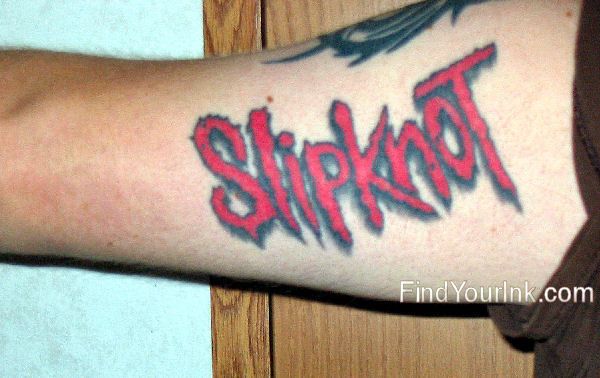 Slipknot Red Color Word Tattoo On Bicep