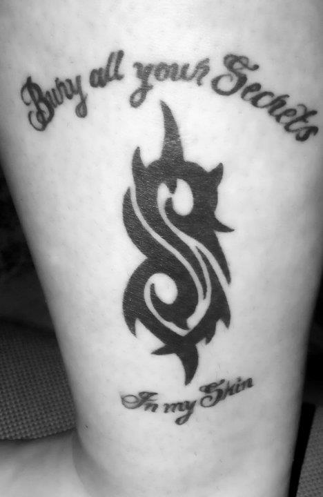 Slipknot Tribal Logo With Lettering Tattoo On Half Sleeve