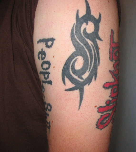 Slipknot Tribal Logo With Lettering Tattoo On Shoulder