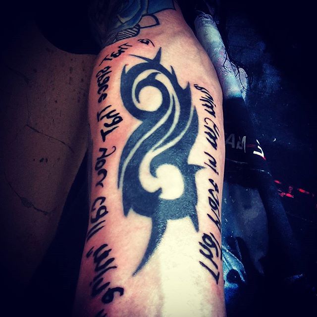 Slipknot Tribal Logo With Lettering Tattoo