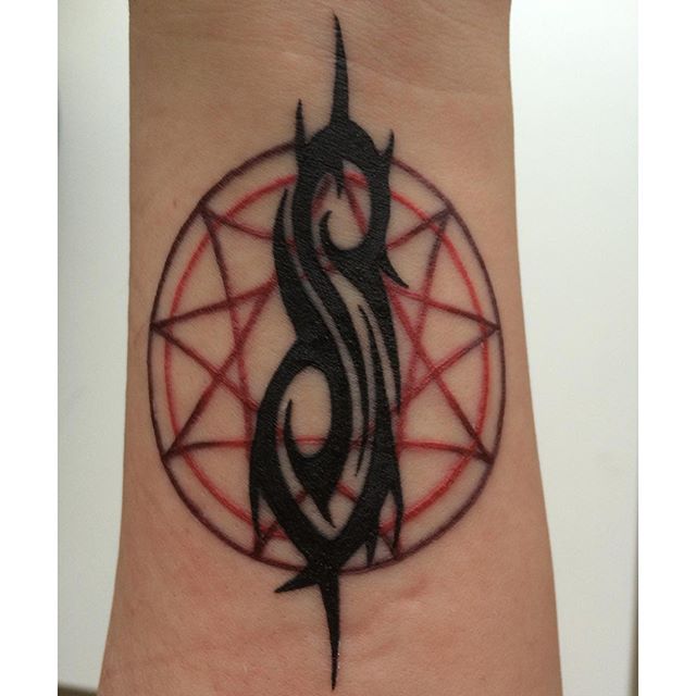 Slipknot Tribal Logo With Star Tattoo On Forearm