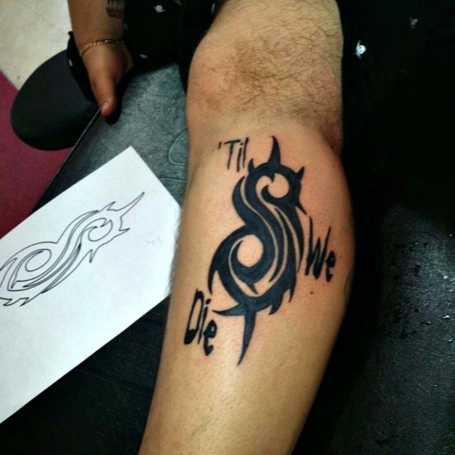 Slipknot Tribal Logo With Til We Die Words Tattoo On Leg