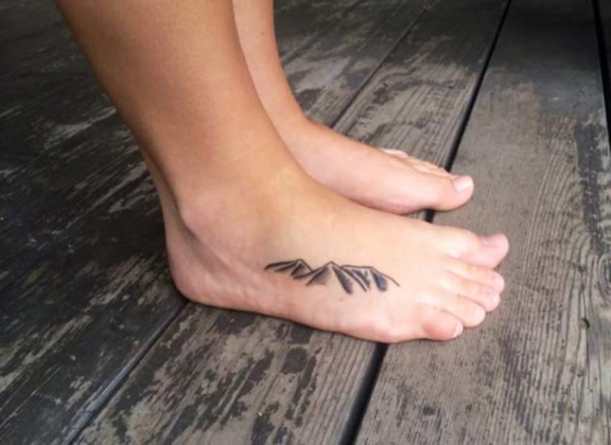 Small And Simple Dotwork Mountains Tattoo On Foot