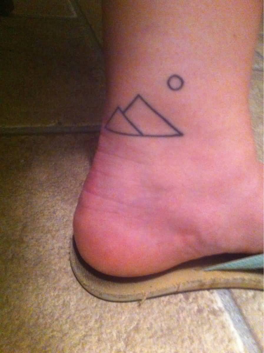 Small And Simple Mountains Outline Tattoo On Back Leg