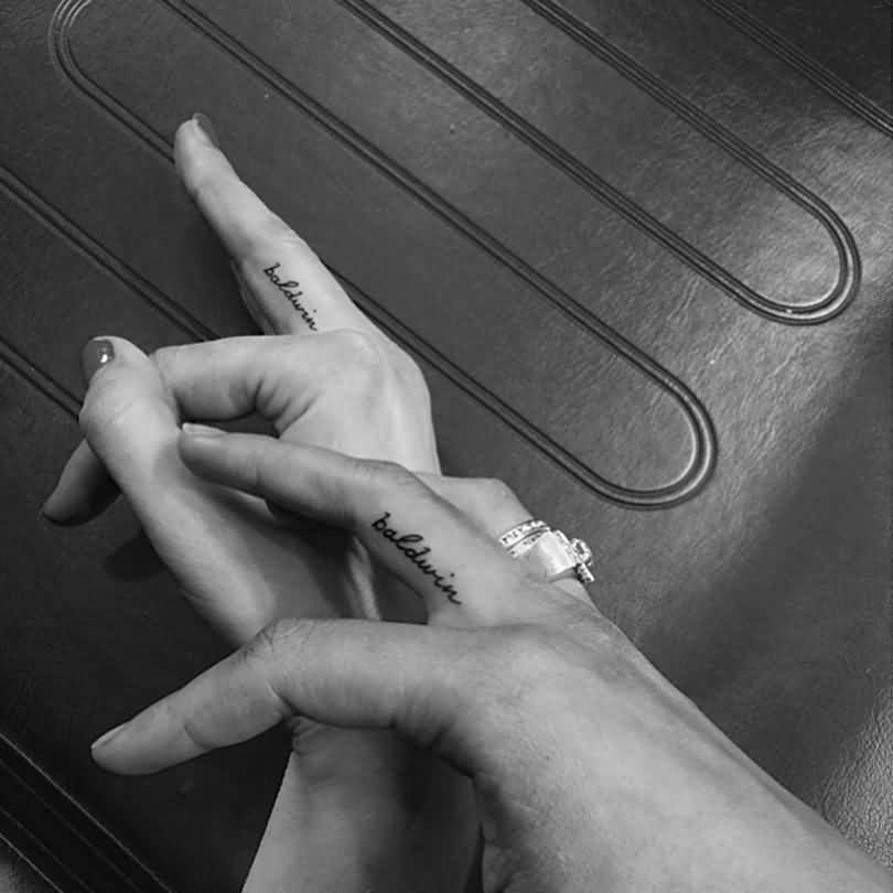Small Baldwin Word Matching Couple Tattoos On Fingers