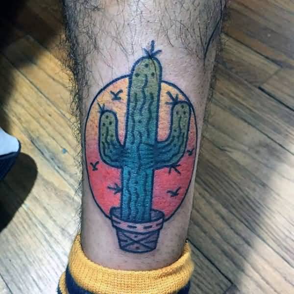 Small Cactus With Circle Traditional Tattoo On Back Leg