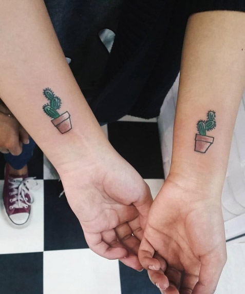 Small Cactus With Pot Tattoos On Wrists By Custom Grey