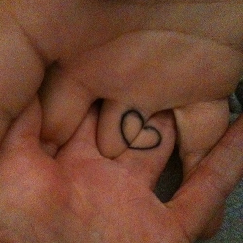 Small Heart Outline Matching Couple Tattoo On Fingers
