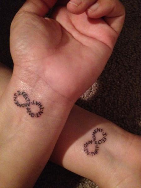 Small Lettering In Infinity Design Matching Tattoos On Wrists