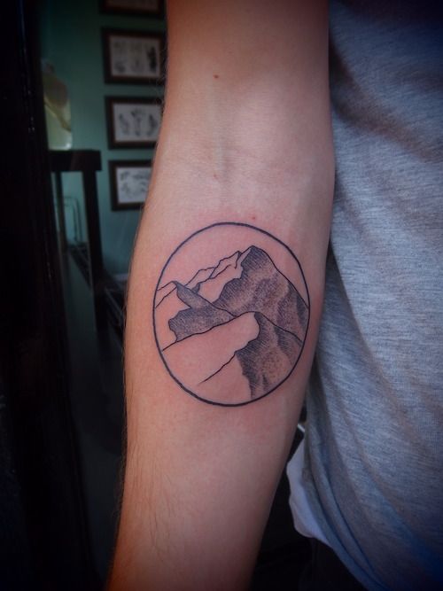 Small Mountains In Circle Dotwork Tattoo On Forearm