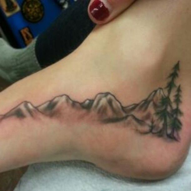 Small Mountains With Trees Tattoo On Foot