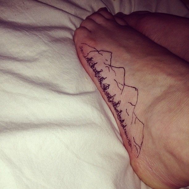 Small Outline Mountains And Pine Trees Tattoo On Foot