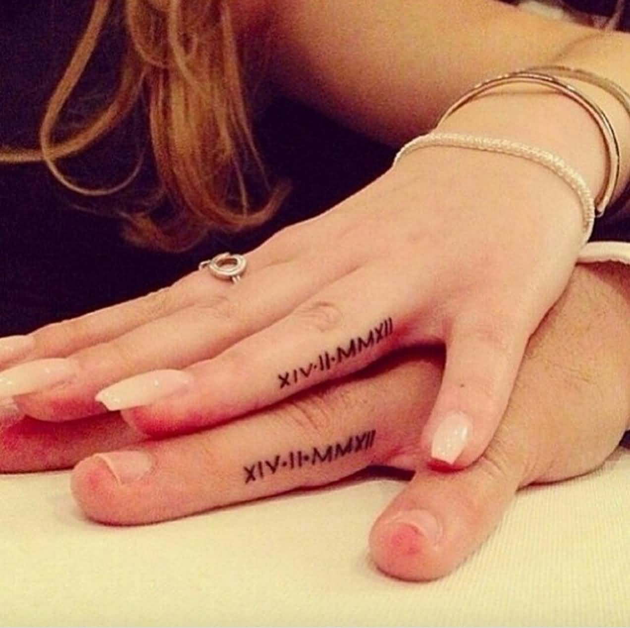 Small Roman Numerals Matching Couple Tattoos On Fingers