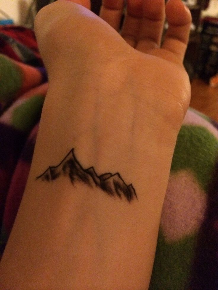 Smallest Black Ink Mountains Tattoo On Arm Sleeve