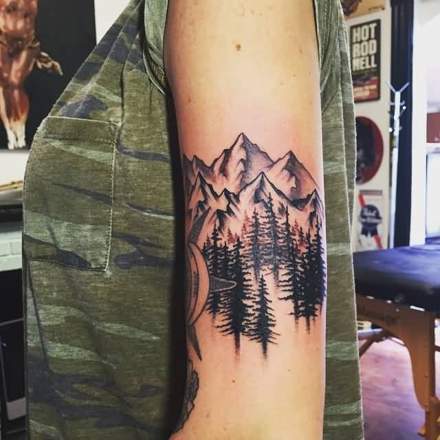 Stylized Mountains And Pine Trees Tattoo On Left Shoulder