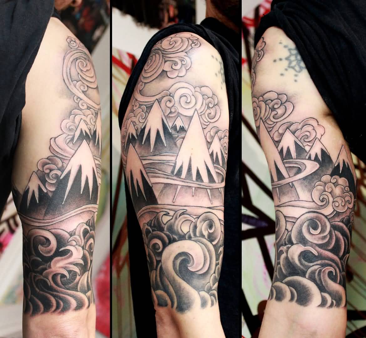 Stylized Mountains With Clouds Tattoo On Half Sleeve