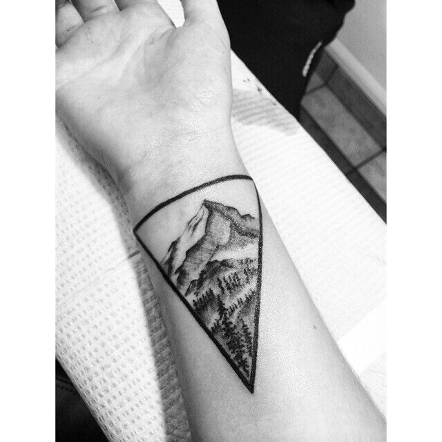 Superb Mountains And Trees In Geometric Shape Tattoo On Wrist