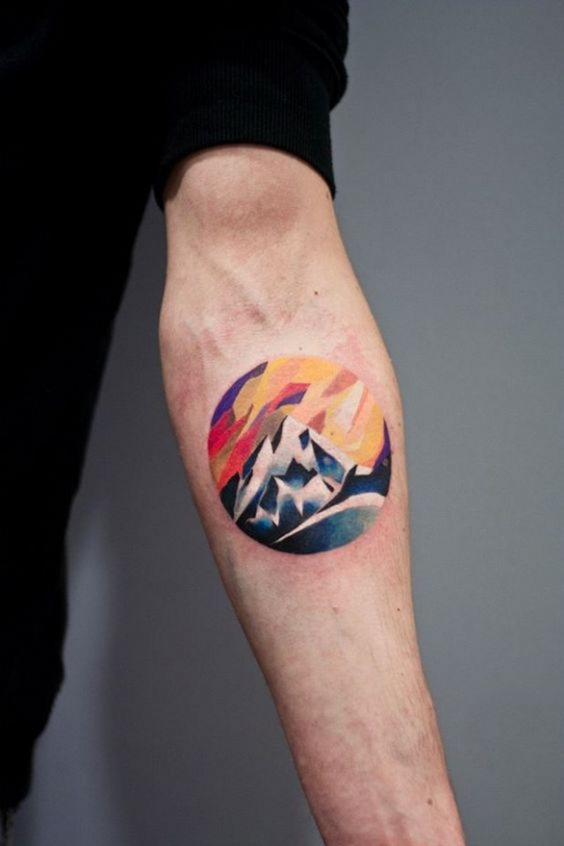 Sweet Little Colorful Mountains In Circle Tattoo On Forearm
