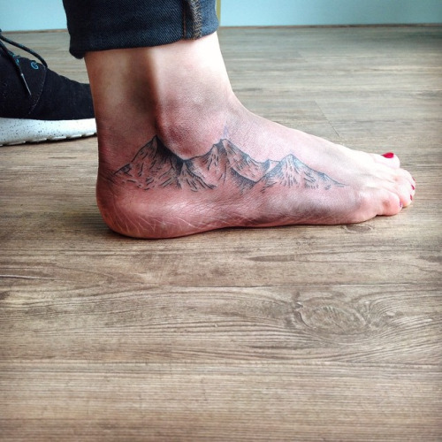 Terrific Mountains Tattoo On Foot