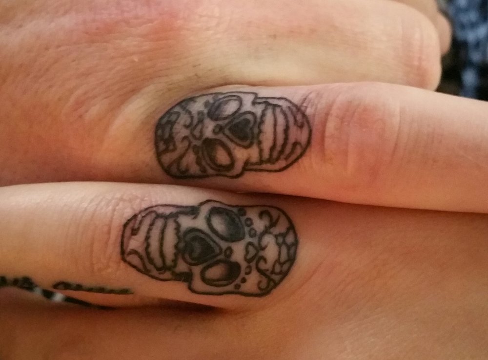 Tiny Sugar Skulls Matching Tattoos On Fingers