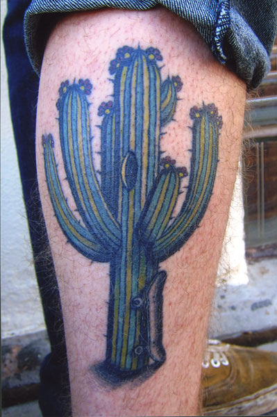 Whole In Cactus With SkateBoard Tattoo On Leg