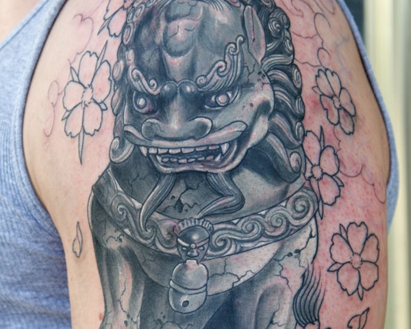 Wonderful Foo Dog With Colorless Flowers Tattoo On Left Shoulder