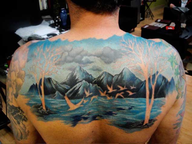 Wonderful Mountains Scenery Tattoo On Upper Back