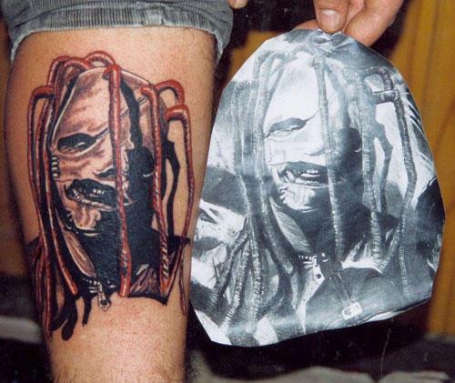 Wonderful Portrait Of Slipknot Member Tattoo On Back Leg