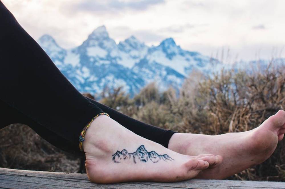Wonderful Small Mountains Tattoo On Foot