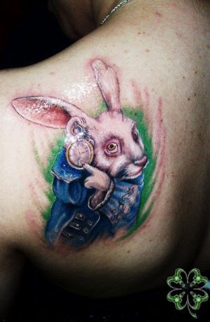 Alice In Wonderland Rabbit Tattoo On Back Shoulder by Sarstattoo