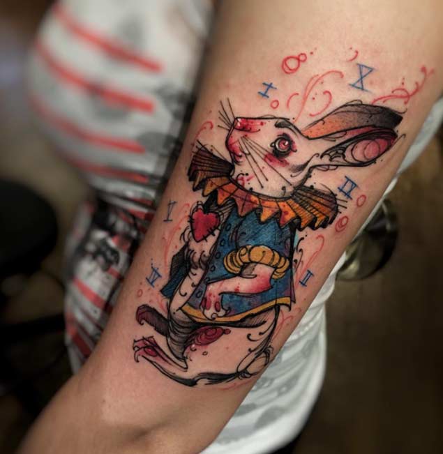 Alice in Wonderland Tattoo On Left Sleeve