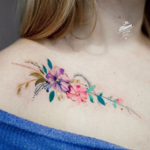 Amazing Colorful Flowers Clavicle Tattoo