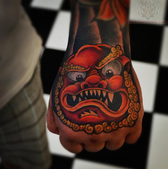Amazing Red Angry Foo Dog Head Tattoo On Hand