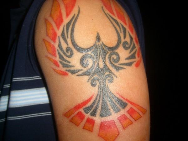 Amazing Tribal Bird With Flames Tattoo On Left Shoulder