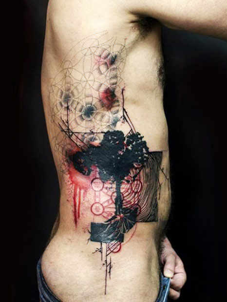 Artistic Tattoo On Man Side Rib