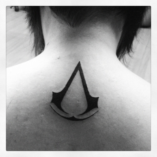 Assassins Creed Tattoo On Girl Upper Back