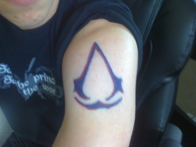 Assassins Creed Tattoo On Left Shoulder by Tarburz