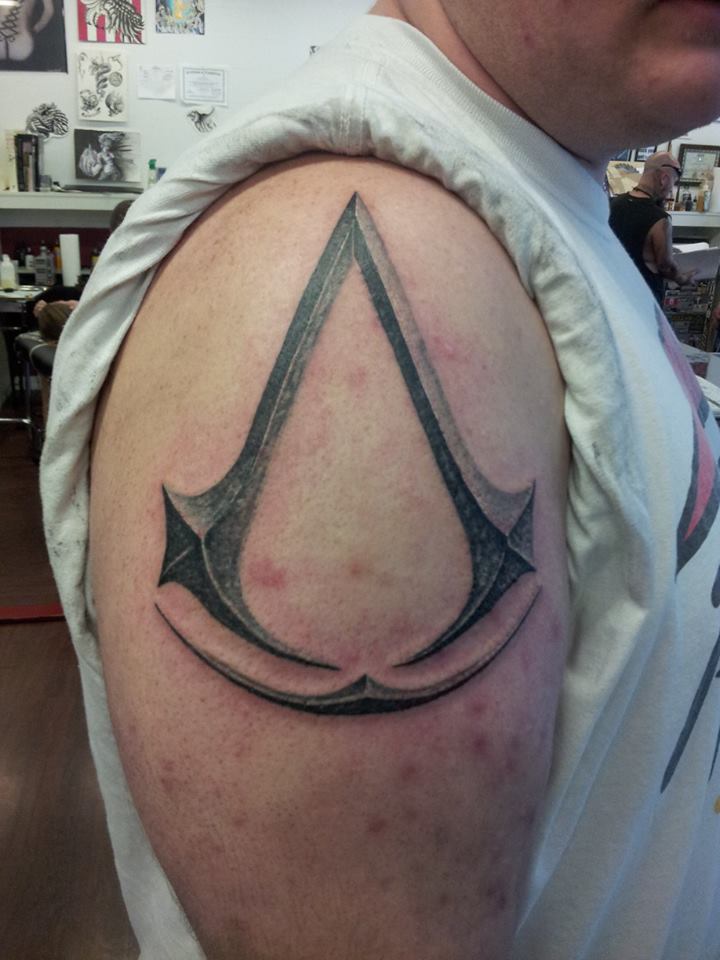 Assassins Creed Tattoo On Right Shoulder by N4sufirestorm