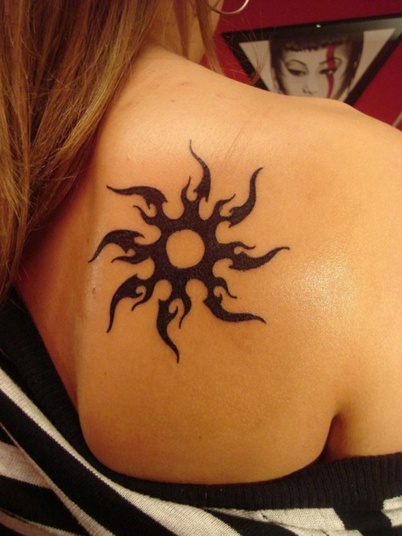 Awesome And Small Tribal Sun Tattoo On Back Right Shoulder