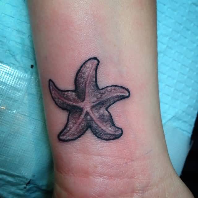 Awesome Black And White Starfish Tattoo On Wrist