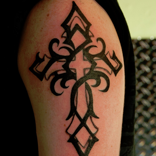 Awesome Cross Wrapped With Tribal Design Tatoo On Half Sleeve