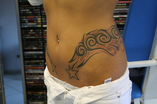 Awesome Tribal Design With Star Tattoo On Left Hip