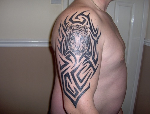 Awesome Tribal Tiger Face With Design Tattoo On Right Half Sleeve
